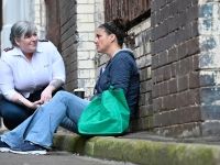homelessness support workers helping young mother and family